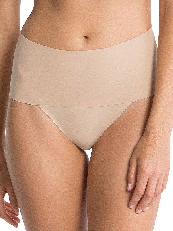 Spanx glotninančios kelnaitės stringai "Undie-tectable® Nude"