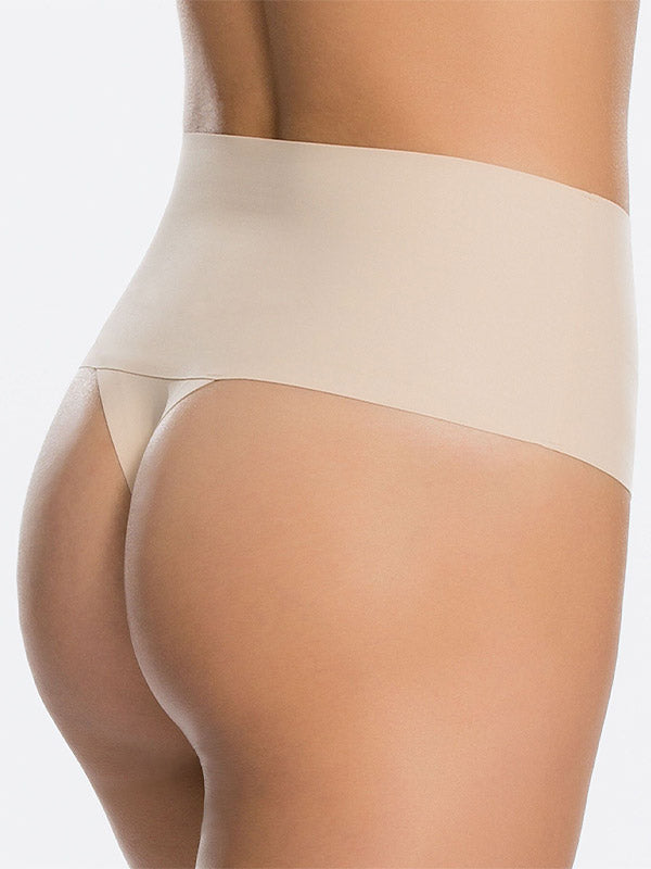 Spanx glotninančios kelnaitės stringai "Undie-tectable® Nude"